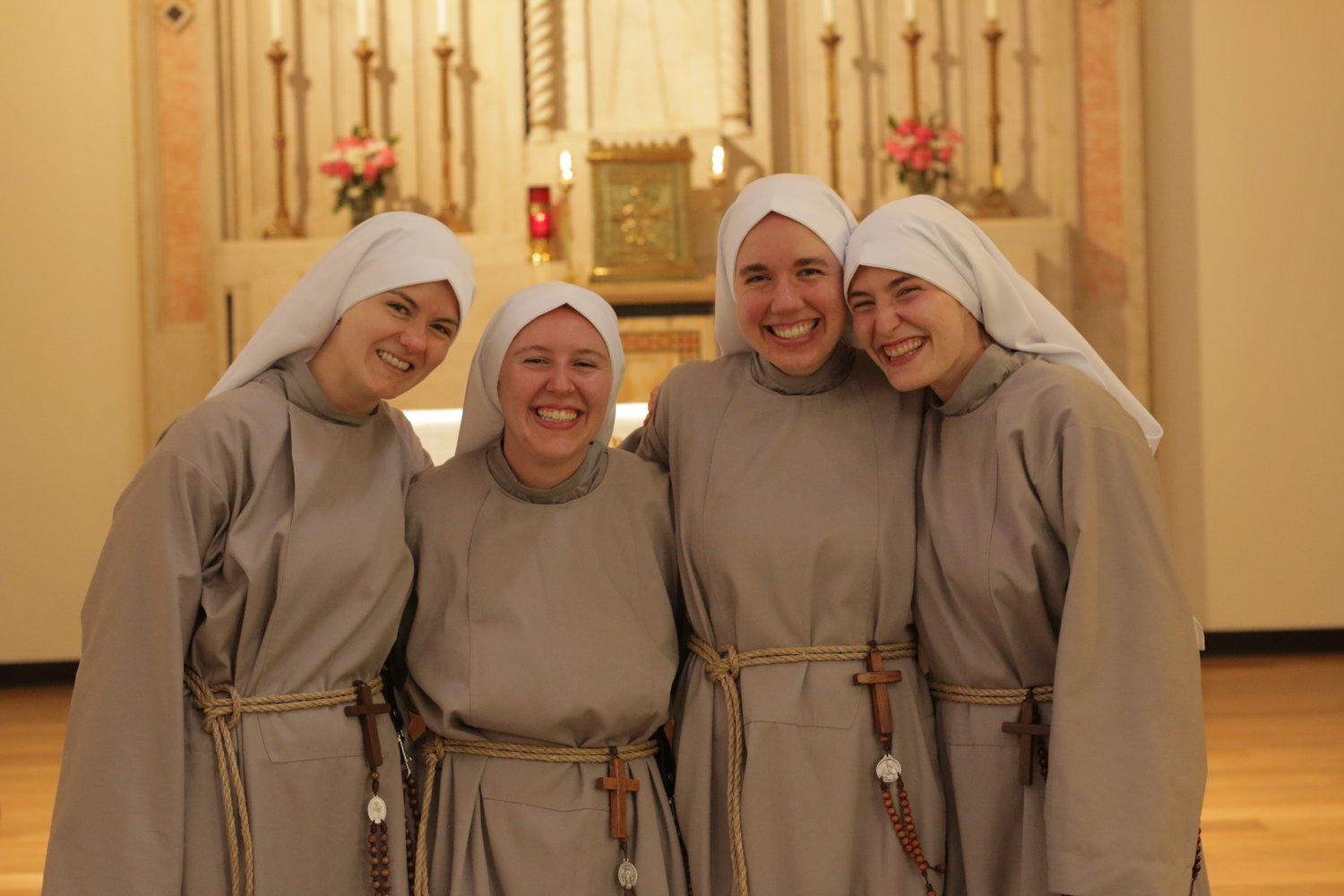 NEW SISTERS—The newly invested Franciscan Sisters of the Renewal are, from left, Sister Mary Joseph,
C.F.R., (Natalie Cook); Sister Solanus, C.F.R. (Mary Margaret Payne); Sister Clara Marie, C.F.R. (Emma
Dickinson); and Sister Fidelis, C.F.R. (Larissa Kriss). Their investiture ceremony, at which Cardinal Dolan
presided, took place Aug. 2.